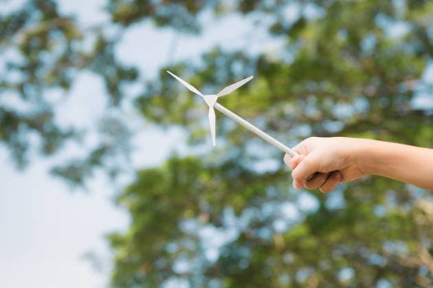 Little boy holding windmill or wind turbine mockup model. Gyre Little boy holding windmill or wind turbine mockup model to promote eco clean and renewable energy technology utilization for future generation and sustainable Earth. Gyre, model released, , 59448242.jpg RECORD DATE NOT STATED