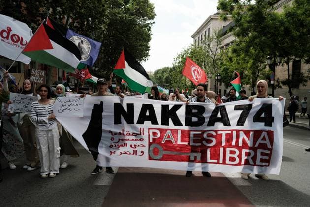 Protest in solidarity with Palestinians in Madrid, Spain - 15 May 2022 May 15, 2022, Madrid, Spain: Protesters hold a banner expressing their opinions during the demonstration in solidarity with the Palestinian people and against the 74 years of Zionist occupation in the Plaza de las Provincias, Madrid. On May 15, as every year for 74 years, the Palestinian People commemorate the Nakba the catastrophe , the moment in which the UN declared the State of Israel. According to UNRWA, there are more than 5.6 million Palestinian refugees in the world. Copyright: xAtilanoxGarciax