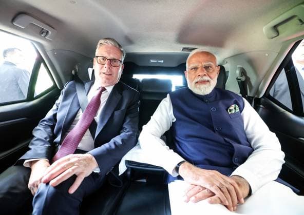 RECORD DATE NOT STATED PM Modi and UK PM Keir Starmer pose for a picture Mumbai, Oct 09 (ANI): Prime Minister Narendra Modi and United Kingdom Prime Minister Keir Starmer pose for a picture on their way to attend the Global Fintech Fest at Jio World Centre, in Mumbai on Thursday. (@narendramodi X ANI Photo) Mumbai Maharashtra India Copyright: xANIx ANI_20251009360
