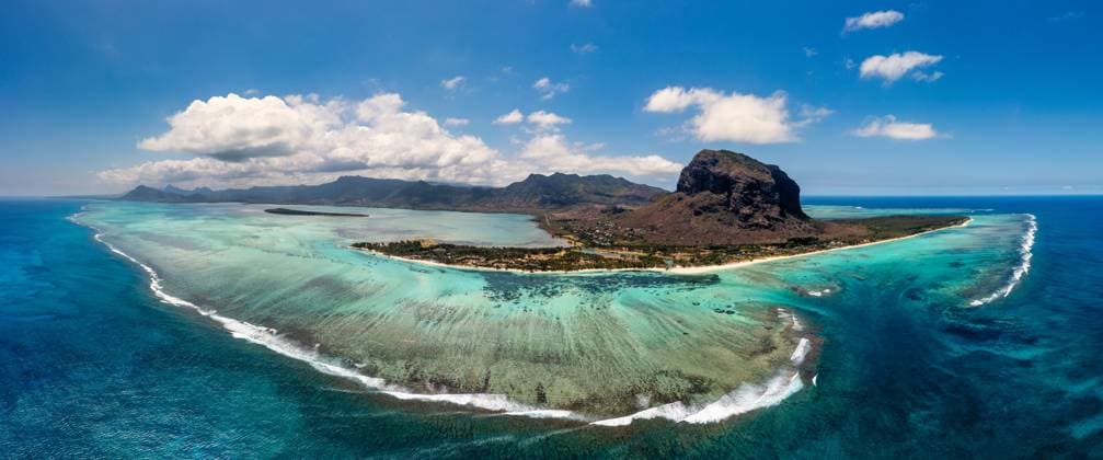 Aerial view of Mauritius island panorama and famous Le Morne Brabant mountain, beautiful blue lagoon and underwater waterfall. Aerial view of Le morne Brabant in Mauriutius. Aerial view of Mauritius island panorama and famous Le Morne Brabant mountain, beautiful blue lagoon and underwater waterfall. Aerial view of Le morne Brabant in Mauriutius., 59819924.jpg RECORD DATE NOT STATED