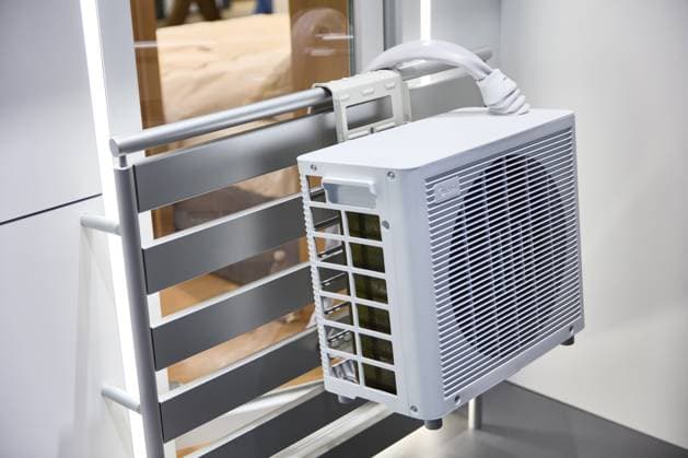 BERLIN, GERMANY - September 7th, 2025: Modern small Midea Portasplit french balcony air conditioning unit at IFA (License=RM)  Copyright: xZoonar.com RobertxKneschkex 24010524