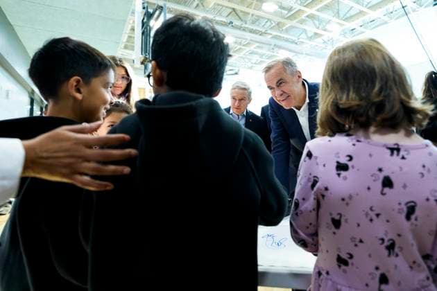 October 10, 2025, Ottawa, On, CAN: Prime Minister Mark Carney speaks with children making art at a community centre before participating in an announcement in Ottawa, on Friday, Oct. 10, 2025. Ottawa CAN  - ZUMAc35_ 20251010_zaf_c35_007 Copyright: xJustinxTangx