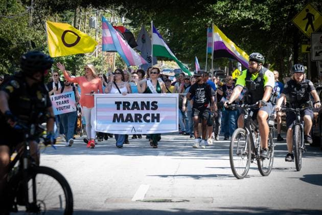 October 11, 2025, Atlanta, Georgia, USA: Atlanta Police officers escort transgender and gender-diverse individuals, families and advocates for the cityÃ¢â‚¬â ¢s annual Transgender Rights march. Atlanta USA - ZUMAn03_ 20251011_zaf_n03_011 Copyright: xRobinxRaynex