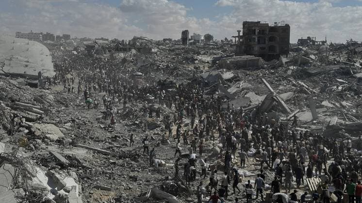 First aid trucks arrive in Gaza after the ceasefire GAZA CITY, GAZA – OCTOBER 12: Palestinians carry sacks of flour and boxes of supplies as they gather amid the rubble to collect humanitarian aid in Khan Yunis, Gaza Strip, on October 12, 2025. The first convoy of aid trucks carrying essential food, medicine, and drinking water entered Gaza through the Kerem Abu Salem border crossing as part of the cease-fire agreement. Doaa Albaz Anadolu Khan Yunis Gaza. Editorial use only. Please get in touch for any other usage.  Copyright: x2025xAnadoluxDoaaxAlbazx