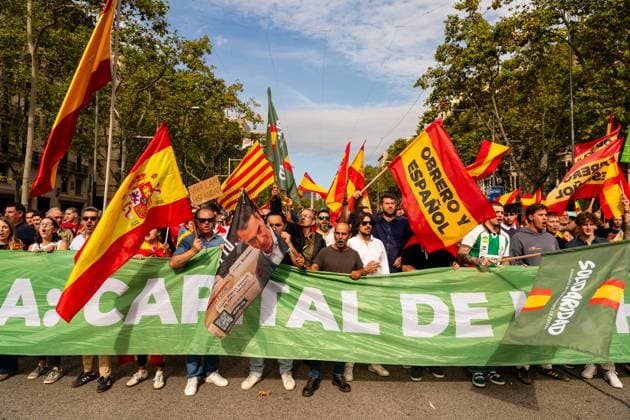 Spain-Barcelona-Spanish National Day in Barcelona, Spain. Barcelona, Spain, 12, October, 2025. Supporters of VOX demonstrate on Paseo de Gracia during Spanish National Day in Downtown, Barcelona, Spain, on October 12, 2025. Barcelona Downtown Barcelona Spain