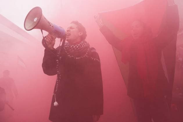 October 12, 2025, Warsaw, Mazowieckie, Poland: Pro-Palestine protestors in the cloud of a smoke bomb on the streets of Warsaw during a demonstration called Warsaw Revolt for Palestine! Red Line Crossed! the day before Egypt hosts an international peace summit meant to finalize an agreement ending the war in Gaza. Warsaw Poland - ZUMAk204 20251012_zip_k204_008 Copyright: xRomanxKozielx