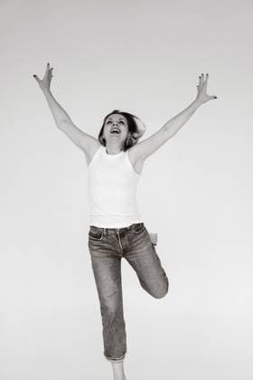 Happy woman jumping with joy in studio, black and white Minsk, Minsk Region, Belarus CR_YUKI251010A-1838675-01 ,model released, Symbolfoto
