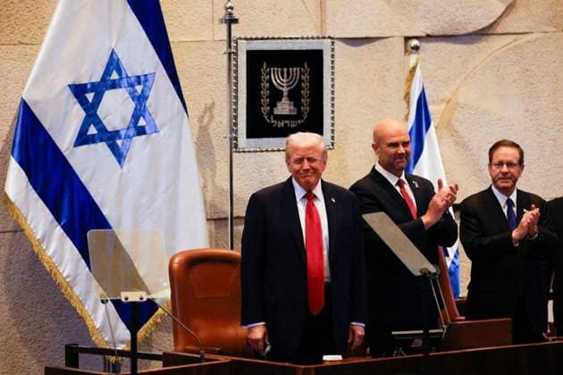 US President Donald Trump reacts as he addresses the Israeli parliament, the Knesset, in Jerusalem on Monday, October 13, 2025. Hamas handed over the 20 surviving Israeli hostages on October 13 under a ceasefire agreement, as the US president and other world leaders geared up for a summit on Gaza. The releases are part of a ceasefire agreement.  JERX20251013108 JALAAxMAREY