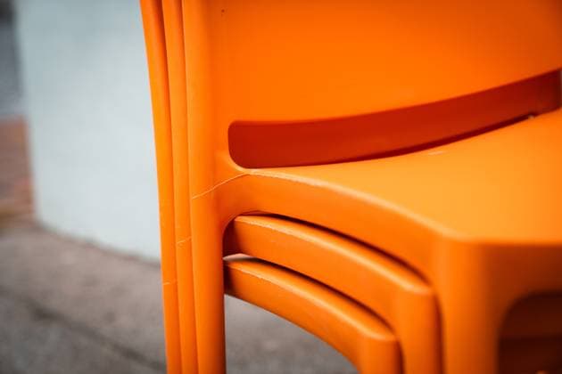 drei orange stühle drei orange Stühle gestapelt vor einer Hauswand (License=RF) Copyright: xZoonar.com Eva-MariaxPollichx 24036665