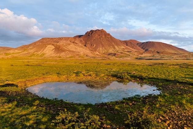 Pond reflecting mountains in evening light, iceland Mosfellsbær, Mosfellsbær, Iceland CR_OSBJ251013-1817305-01