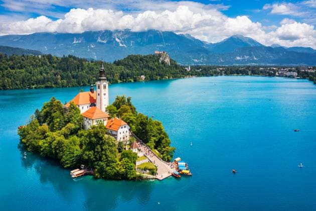 Lake Bled in Slovenia. Beautiful mountains and Bled lake with small Pilgrimage Church. Bled lake and island with Pilgrimage Church of the Assumption of Maria. Bled, Slovenia, Europe. Lake Bled in Slovenia. Beautiful mountains and Bled lake with small Pilgrimage Church. Bled lake and island with Pilgrimage Church of the Assumption of Maria. Bled, Slovenia, Europe., 59490188.jpg RECORD DATE NOT STATED