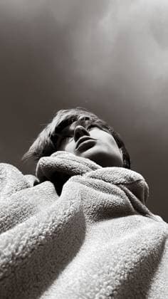 Low angle black and white portrait of a young woman in a fuzzy coat Minsk, Minsk Region, Belarus R_YUKI251013-1858935-01 ,model released, Symbolfoto