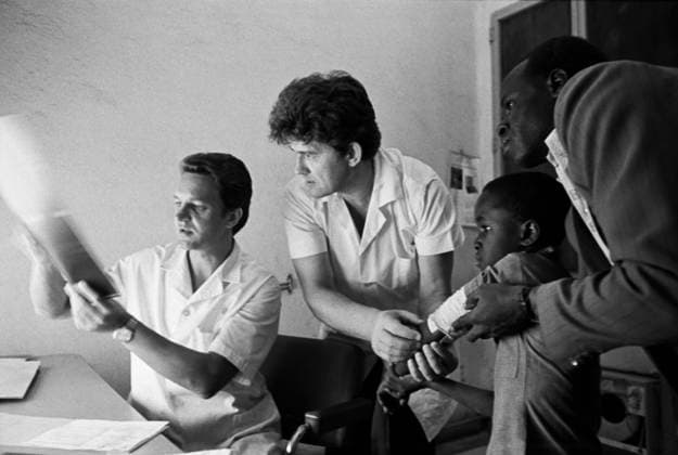 January 1 - February 23, 1979. Bamako, Mali. Soviet doctors - radiologist V. Bogdanov from Leningrad and surgeon Y. Pokrovsky from Makeyevka (L-R) - study an X-ray of the patient at a city hospital. The exact date of the photograph is unknown. Igor Zotin TASS  15642671