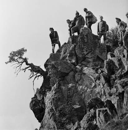 April 1-17, 1976. Kabardino-Balkar ASSR, USSR. Tourists stand on a rock in the Elbrus Region mountains. The exact date of the photograph is unknown. Rudolf Dik TASS  19067711