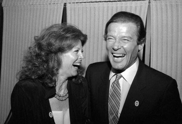 Samantha Eggar and Roger Moore Circa 1980 s. Copyright: xRalphxDominguez MediaPunchx
