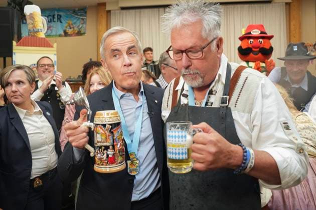 October 17, 2025, Breslau, On, Canada: Prime Minister Mark Carney, left, displays his beer moustache after taking a sip of beer with Darryl Fletcher, President of the Board of Oktoberfest, at an Oktoberfest event, at the Schwaben Club in Breslau, Ont., on Friday, Oct. 17, 2025. Breslau Canada - ZUMAc35_ 20251017_zaf_c35_040 Copyright: xChrisxYoungx