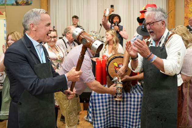October 17, 2025, Breslau, On, Canada: Prime Minister Mark Carney, left, reacts after tapping a keg at an Oktoberfest event at the Schwaben Club in Breslau, Ont., on Friday, Oct. 17, 2025. Breslau Canada - ZUMAc35_ 20251017_zaf_c35_044 Copyright: xChrisxYoungx