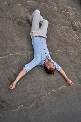 Businessman lying upside down on street exhausted with copy space model released, Symbolfoto, BEF00223