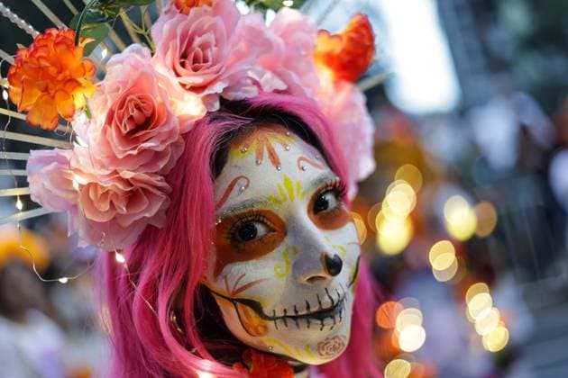 (251027) -- MEXICO CITY, Oct. 27, 2025 -- A participant with facial makeup takes part in the Catrinas Parade in Mexico City, capital of Mexico, on Oct. 26, 2025. The Catrinas Parade was held on Sunday ahead of the Day of the Dead. (Photo by Francisco Canedo Xinhua) MEXICO-MEXICO CITY-PARADE-CATRINAS LixMengxin 