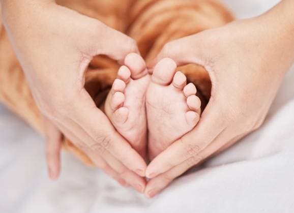 Love, heart hands and feet of baby on bed for care, affection or growth in bedroom. Adorable, person and infant kid with safety for motherhood, child development or comfort in nursery of home Love, heart hands and feet of baby on bed for care, affection or growth in bedroom. Adorable, person and infant kid with safety for motherhood, child development or comfort in nursery of home., model released, , property released, , 61029892.jpg RECORD DATE NOT STATED