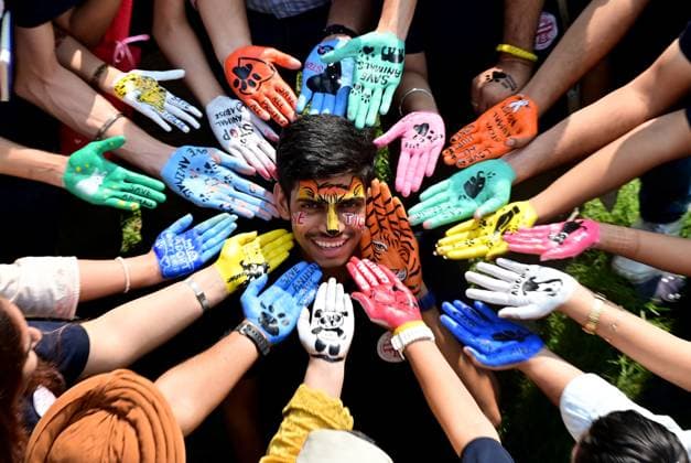 CHANDIGARH, INDIA - OCTOBER 29: Centre for Social Work students painted their hands for animal welfare to mark the International Day of Care and Support at Panjab University Campus on October 29, 2025 in Chandigarh, India. (Photo by Ravi Kumar Hindustan Times) Panjab University Students Celebrate The International Day of Care And Support