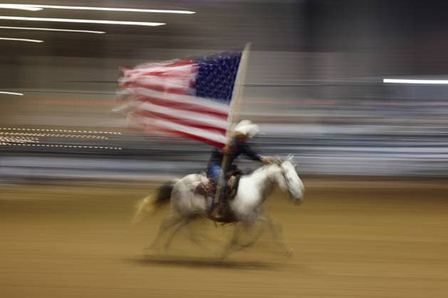 Williamson County Fair &amp; Rodeo in Texas TAYLOR, UNITED STATES - OCTOBER 23: A horse rider carrying the American flag takes part in the Williamson County Fair &amp; Rodeo in Taylor, United States on October 23, 2025. Jakub Porzycki Anadolu Texas United States. Editorial use only. Please get in touch for any other usage.  Copyright: x2025xAnadoluxJakubxPorzyckix