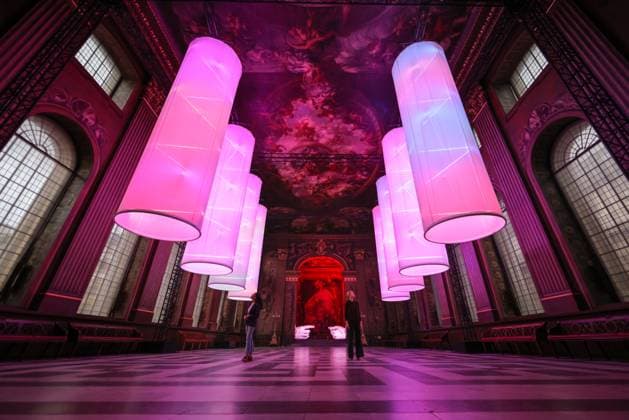 Peter Walker Connection and Identity installations photocall at the Painted Hall, Old Royal Naval College Greenwich, London, UK London, UK. 31th Oct 2025. Staff with Peter Walker s installations Connection and Identity in the Painted Hall at Old Royal Naval College, Greenwich. Identity shows eight illuminated suspended columns, evoking DNA structures, and Connection is a modern re-interpretation of Michelangelo™s Creation of Adam, replacing the traditionally male hands with casts of women™s hands., Credit:Imageplotter Avalon  Copyright: xImageplotterx xAvalonx 1049395571