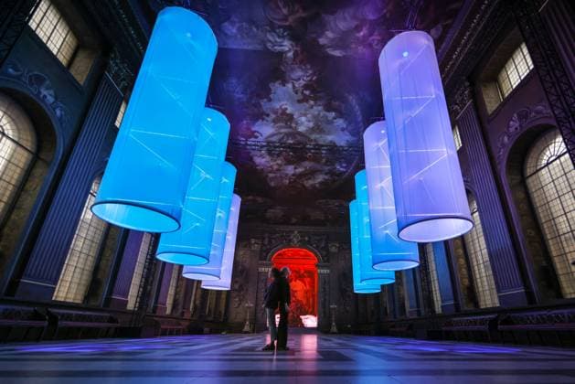 Peter Walker Connection and Identity installations photocall at the Painted Hall, Old Royal Naval College Greenwich, London, UK London, UK. 31th Oct 2025. Staff with Peter Walker s installations Connection and Identity in the Painted Hall at Old Royal Naval College, Greenwich. Identity shows eight illuminated suspended columns, evoking DNA structures, and Connection is a modern re-interpretation of Michelangelo™s Creation of Adam, replacing the traditionally male hands with casts of women™s hands., Credit:Imageplotter Avalon  Copyright: xImageplotterx xAvalonx 1049395587