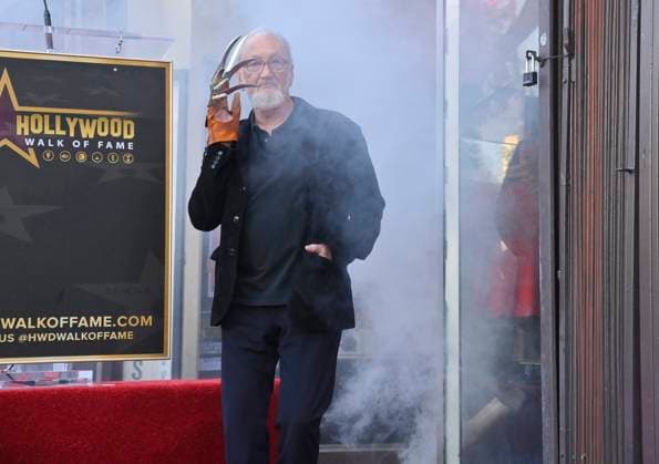 American actor and director Robert Englund, who is best known for his portrayal of the villainous Freddie Krueger stands over his star during an unveiling ceremony honoring him with the 2, 826th star on the Hollywood Walk of Fame in Los Angeles on Friday, October 31, 2025.  LAP2025103109 JIMxRUYMEN