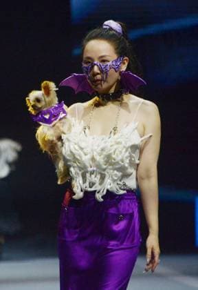 SHANGHAI, CHINA - OCTOBER 31: A pet owner and her pet walk the runway during the 5th Petjoy Fashion Week at Shanghai Fashion Center on October 31, 2025 in Shanghai, China. The 2025 Petjoy Fashion Week opened on October 31 in Shanghai, bringing together global brands, innovative designs, and lifestyle trends that highlight the fast-growing pet industry.  Copyright: xVCGx 111600987229