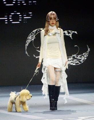 SHANGHAI, CHINA - OCTOBER 31: A pet owner and her pet walk the runway during the 5th Petjoy Fashion Week at Shanghai Fashion Center on October 31, 2025 in Shanghai, China. The 2025 Petjoy Fashion Week opened on October 31 in Shanghai, bringing together global brands, innovative designs, and lifestyle trends that highlight the fast-growing pet industry.  Copyright: xVCGx 111600987215