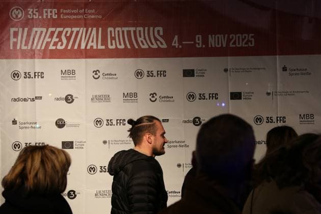 November 4, 2025, Cottbus, Brandenburg, Germany: Guests line up in front of the Staatstheater Cottbus ahead of the opening ceremony of the 35th FilmFestival Cottbus (FFC), one of the leading events dedicated to Eastern European cinema. The 2025 edition runs from November 4 to 9, presenting around 140 films from more than 40 countries. Held in Cottbus, a bilingual German-Sorbian city near the Polish border, the festival brings together filmmakers, industry representatives, and audiences to celebrate cultural diversity and promote Central and Eastern European cinema. Cottbus Germany - ZUMAf146 20251104_zip_f146_006 Copyright: xRouzbehxFouladix