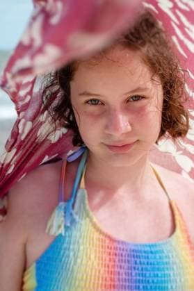 Confident teen age girl smiling, wearing swimsuit at seaside Corby, England, United Kingdom R_ATMT250322FC-1687486-01 ,model released, Symbolfoto