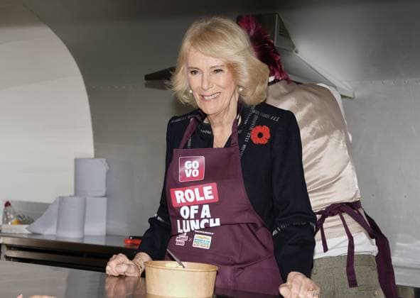 Community volunteering celebration Queen Camilla helps Spudman prepare food as he delivers jacket potatoes in a Royal Voluntary Service food truck, as she hosts members of the National Association of Care Catering (NACC), and representatives from Royal Voluntary Service (RVS) in a celebration of community volunteering during Meals on Wheels Week, at Clarence House in central London. Picture date: Wednesday November 5, 2025., Credit:Jordan Pettitt Avalon UK, London  Copyright: xJordanxPettittx xAvalonx 1050493198