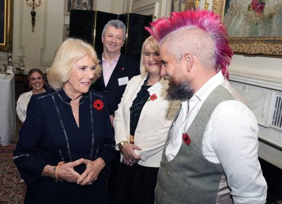 Community volunteering celebration Queen Camilla speaks to Spudman, as she hosts members of the National Association of Care Catering (NACC), and representatives from Royal Voluntary Service (RVS) in a celebration of community volunteering during Meals on Wheels Week, at Clarence House in central London. Picture date: Wednesday November 5, 2025., Credit:Jordan Pettitt Avalon UK, London  Copyright: xJordanxPettittx xAvalonx 1050498333