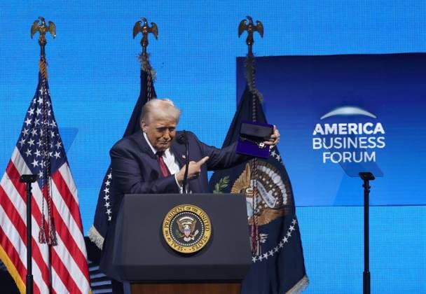 November 5, 2025, Miami, Florida, US: President Donald J. Trump points to the Ã¢â‚¬oeKey-to-the-CityÃ¢â‚¬Â given to him by Mayor Francis Suarez as he prepares to leave the stage during American Business Forum at the Kaseya Center in Miami on Wednesday, Nov. 5, 2025. Miami US - ZUMAm67_ 20251105_zaf_m67_006 Copyright: xCarlxJustex