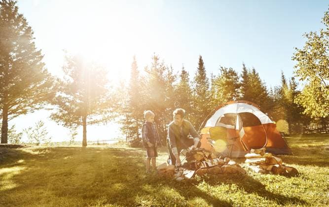 Father, son and camping with fire by tent for outdoor summer, vacation or holiday together in nature. Happy dad bonding with child, kid or little boy on grass field by wood for campfire in forest Father, son and camping with fire by tent for outdoor summer, vacation or holiday together in nature. Happy dad bonding with child, kid or little boy on grass field by wood for campfire in forest., model released, , 60722962.jpg RECORD DATE NOT STATED