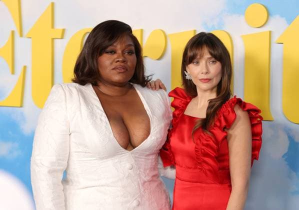 Da Vine Joy Randolph and Elizabeth Olsen attend the Los Angeles Special Screening of A24 s Eternity at the AMC Century City 15 in Los Angeles, CA on Wednesday, November 5, 2025. Storyline: In an afterlife where souls have one week to decide where to spend eternity, Joan is faced with the impossible choice between the man she spent her life with and her first love, who died young and has waited decades for her to arrive.  LAP20251105855 GREGxGRUDT