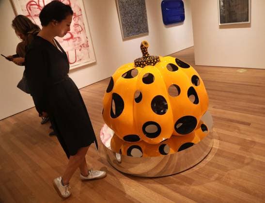 November 7, 2025, New York, New York, USA: A woman seen with Pumpkin by Yayoi Kusama, estimate $1.7 million - $ 2.5 million during November Marquee Week 2025 during SothebyÃ¢â‚¬â ¢s Opening of the New Global Headquarters at the Breuer. New York USA - ZUMAk03_ 20251107_zaf_k03_064 Copyright: xNancyxKaszermanx