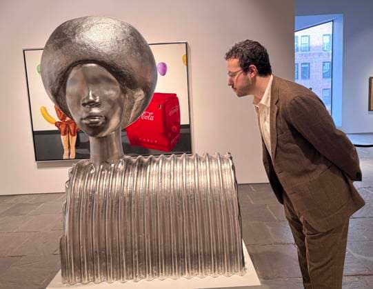 November 7, 2025, New York, New York, USA: A man looks at Sphinx by artist Simone Leigh, estimate $700,000 - $1 million, seen on display during November Marquee Week 2025 during SothebyÃ¢â‚¬â ¢s Opening of the New Global Headquarters at the Breuer. New York USA - ZUMAk03_ 20251107_zaf_k03_116 Copyright: xNancyxKaszermanx