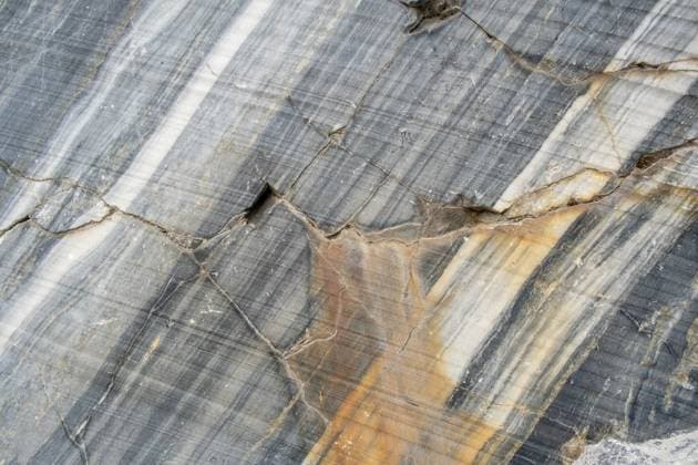The surface of marble reveals intricate natural veins and textures highlighting its rich colors and patterns, found in a quarry setting The surface of marble reveals intricate natural veins and textures highlighting its rich colors and patterns, found in a quarry setting., 62118896.jpg RECORD DATE NOT STATED