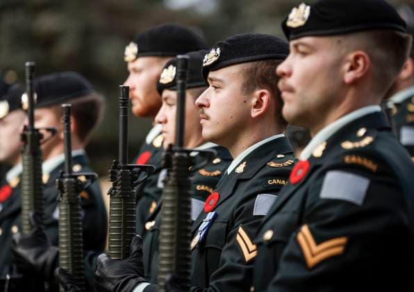 November 9, 2025, Calgary, Ab, CANADA: Members of the KingöÄÃ s Own Calgary Regiment present arms during a graveside ceremony honouring Cpl. Gawen Foster, who served with the 50th Canadian Infantry Battalion, Canadian Expeditionary Force, during the First World War, in Calgary, Sunday, Nov. 9, 2025. Calgary CANADA - ZUMAc35_ 20251109_zaf_c35_028 Copyright: xJeffxMcintoshx