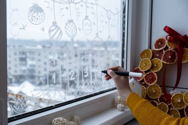Creative enthusiastic unrecognizable woman in sweater paint window with white marker. Advent candle decoration on big clear window. Snowy winter outside Creative enthusiastic unrecognizable woman in sweater paint window with white marker. Advent candle decoration on big clear window. Snowy winter outside. Holiday preparation, 62868376.jpg RECORD DATE NOT STATED