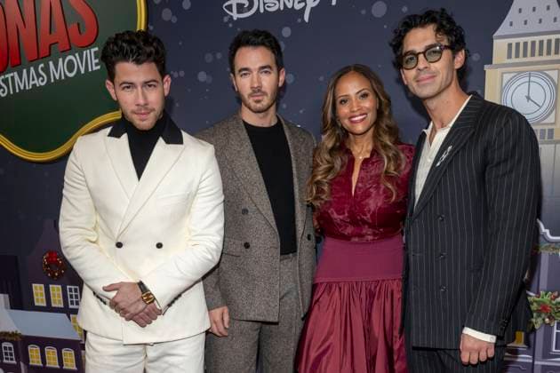 November 10, 2025, New York, United States: (L-R) Nick Jonas, Kevin Jonas, Ayo Davis and Joe Jonas attend Disney+ s A Very Jonas Christmas Movie New York Premiere at New York City Center. New York United States - ZUMAs197 20251110_aaa_s197_417 Copyright: xRonxAdarx