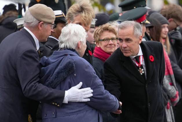 November 11, 2025, Ottawa, On, Canada: Prime Minister Mark Carney, right, greets National Silver Cross Mother, Mrs. Nancy Payne, of Lansdowne, Ont., during a Remembrance Day ceremony in Ottawa on Tuesday, Nov. 11, 2025. Ottawa Canada - ZUMAc35_ 20251111_zaf_c35_026 Copyright: xSeanxKilpatrickx