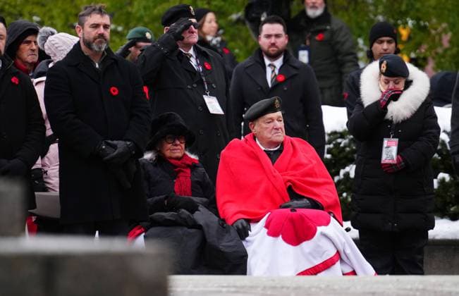 November 11, 2025, Ottawa, On, Canada: Second World War veteran John Preece, 99, sits with his wife during a Remembrance Day ceremony in Ottawa on Tuesday, Nov. 11, 2025. Ottawa Canada  - ZUMAc35_ 20251111_zaf_c35_028 Copyright: xSeanxKilpatrickx