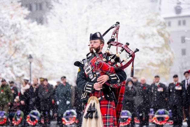 November 11, 2025, Montreal, Pq, CANADA: A bagpiper leads members of the Canadian Armed Forces during a Remembrance Day ceremony, in Montreal, Tuesday, Nov. 11, 2025. Montreal CANADA  - ZUMAc35_ 20251111_zaf_c35_096 Copyright: xChristopherxKatsarovx
