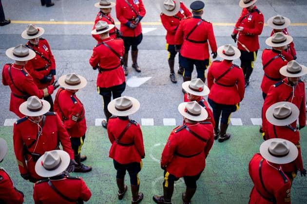 November 11, 2025, Vancouver, Bc, CANADA: RCMP constables wait to form up for a parade before a Remembrance Day ceremony, in Vancouver, B.C., Tuesday, Nov. 11, 2025. Vancouver CANADA  - ZUMAc35_ 20251111_zaf_c35_227 Copyright: xEthanxCairnsx