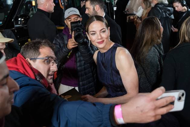 November 11, 2025, London, England, United Kingdom: MICHELLE MONAGHAN poses for a selfie with a fan as she attends the World Premiere of The Family Plan 2 at Curzon Mayfair in London. London United Kingdom - ZUMAs371 20251111_zip_s371_053 Copyright: xWiktorxSzymanowiczx