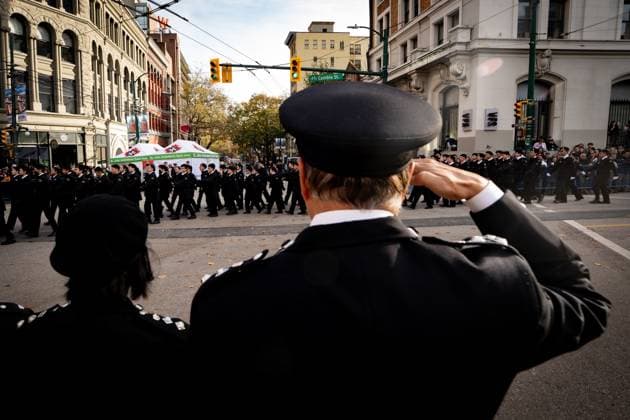 November 11, 2025, Vancouver, Bc, CANADA: A man salutes as people march by in a parade during a Remembrance Day ceremony, in Vancouver, B.C., Tuesday, Nov. 11, 2025. Vancouver CANADA  - ZUMAc35_ 20251111_zaf_c35_238 Copyright: xEthanxCairnsx